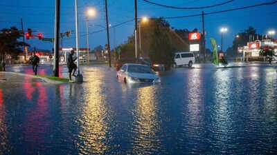 Tropical storm remnants drench Gulf states after tornadoes hit the Midwest