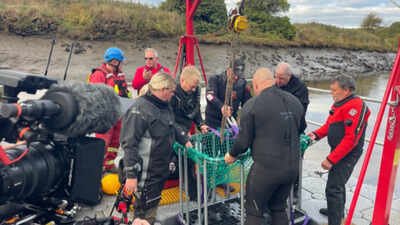 A diver searching the bottom of England’s River Wear has pulled up a huge three-legged iron cauldron that lay hidden underwater for hundreds of years, and researchers are still trying to work out how it got there